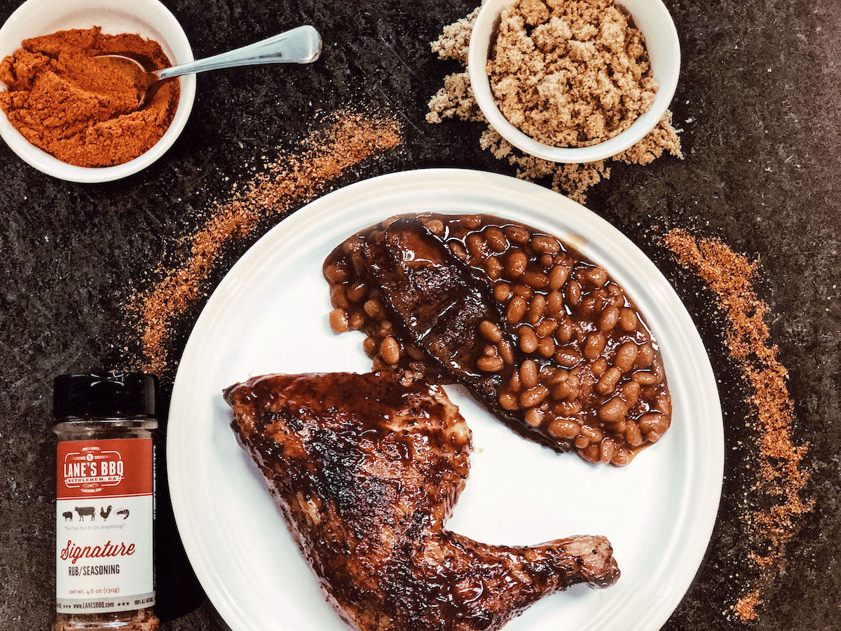 Signature Smoked Chicken Quarters and Baked Beans