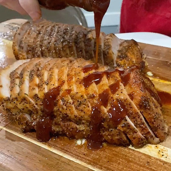Sliced pork loin with pineapple chipotle drizzle